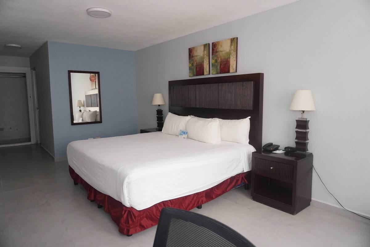 Suite, 1 King Bed, Non Smoking | Minibar, desk, blackout drapes, iron/ironing board (on request)