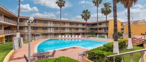 Outdoor pool, open 9:00 AM to 10:00 PM, pool loungers