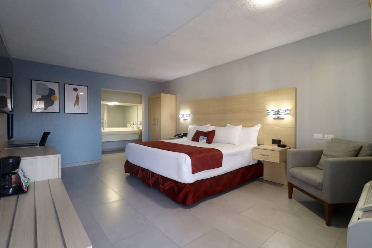 Room, 1 King Bed, Non Smoking (Upgrade) | Minibar, desk, blackout drapes, iron/ironing board