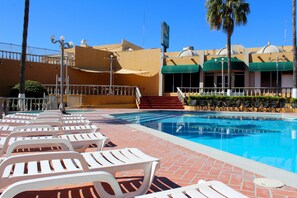 Outdoor pool, open 9:00 AM to 10:00 PM, sun loungers