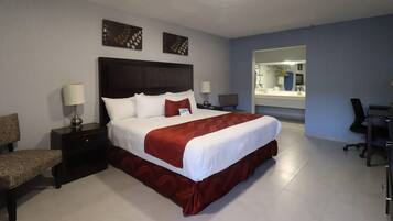 Suite, 1 King Bed, Non Smoking | Minibar, desk, blackout drapes, iron/ironing board