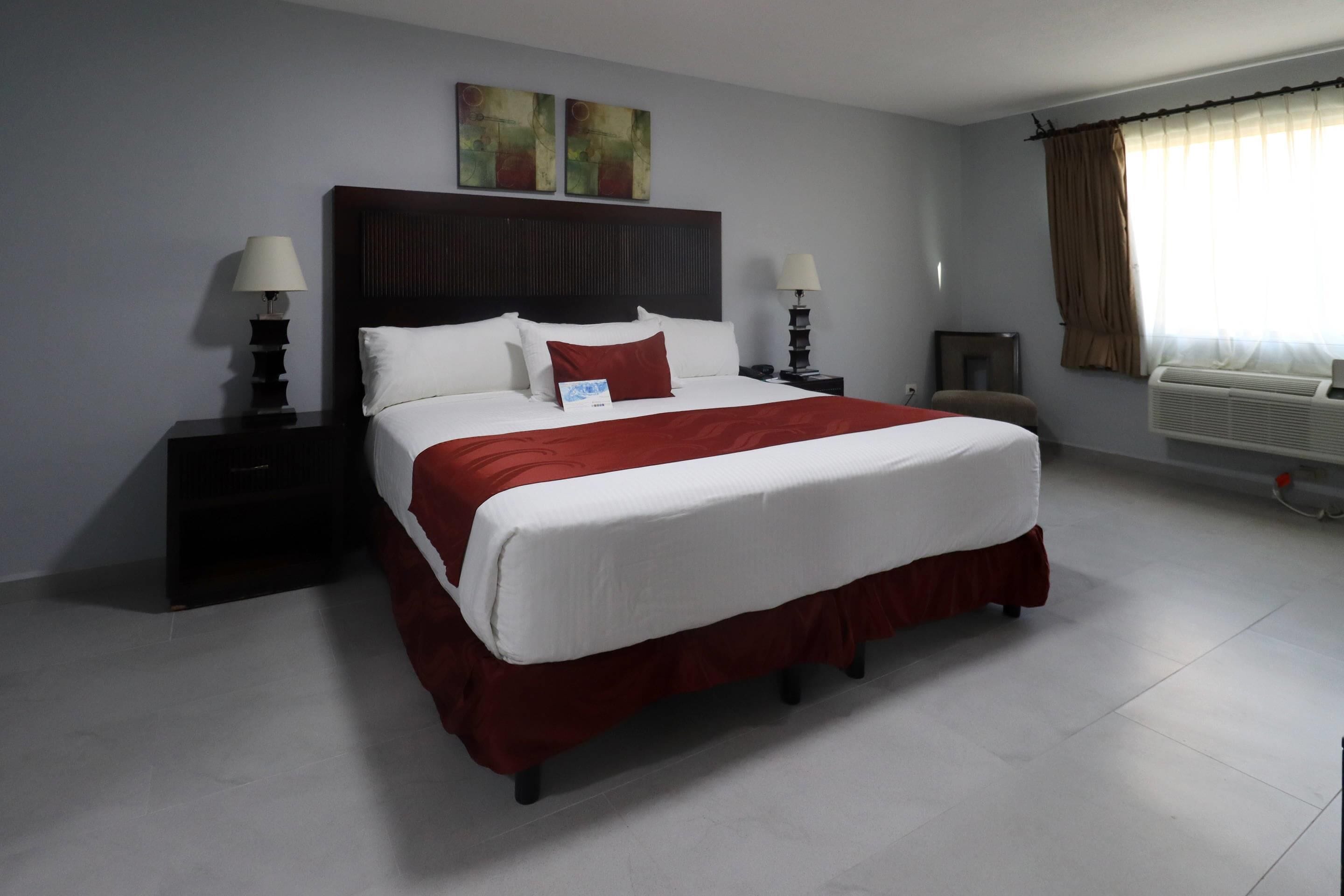 Minibar, desk, blackout curtains, iron/ironing board