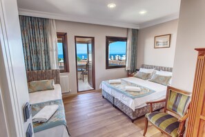 Family Triple Room, 1 Bedroom, Private Bathroom, Sea View | Hypo-allergenic bedding, minibar, in-room safe, desk