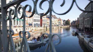 A canal with boats and buildings along the water.