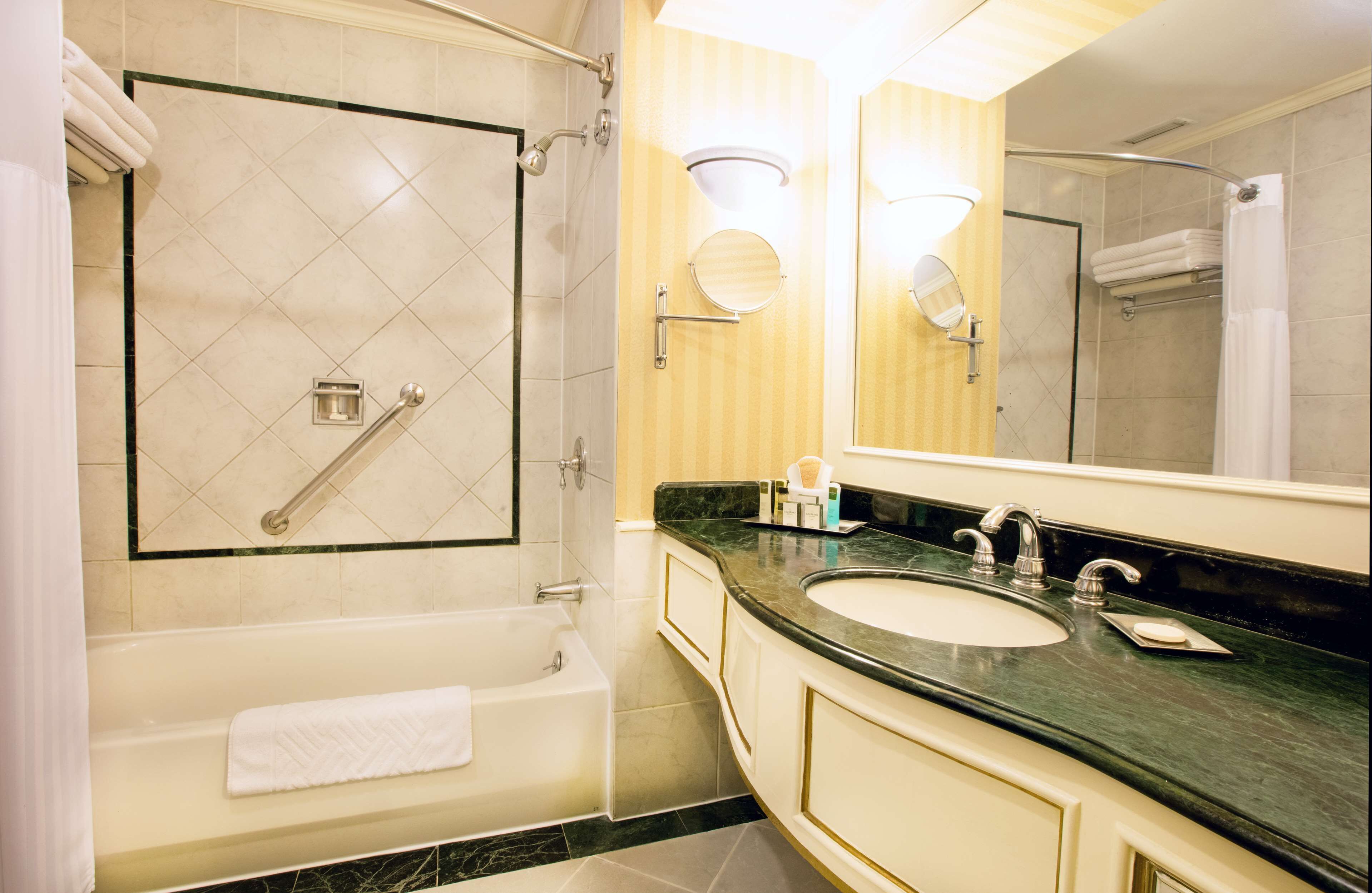 combined shower/bathtub, eco-friendly toiletries, hair dryer, bathrobes