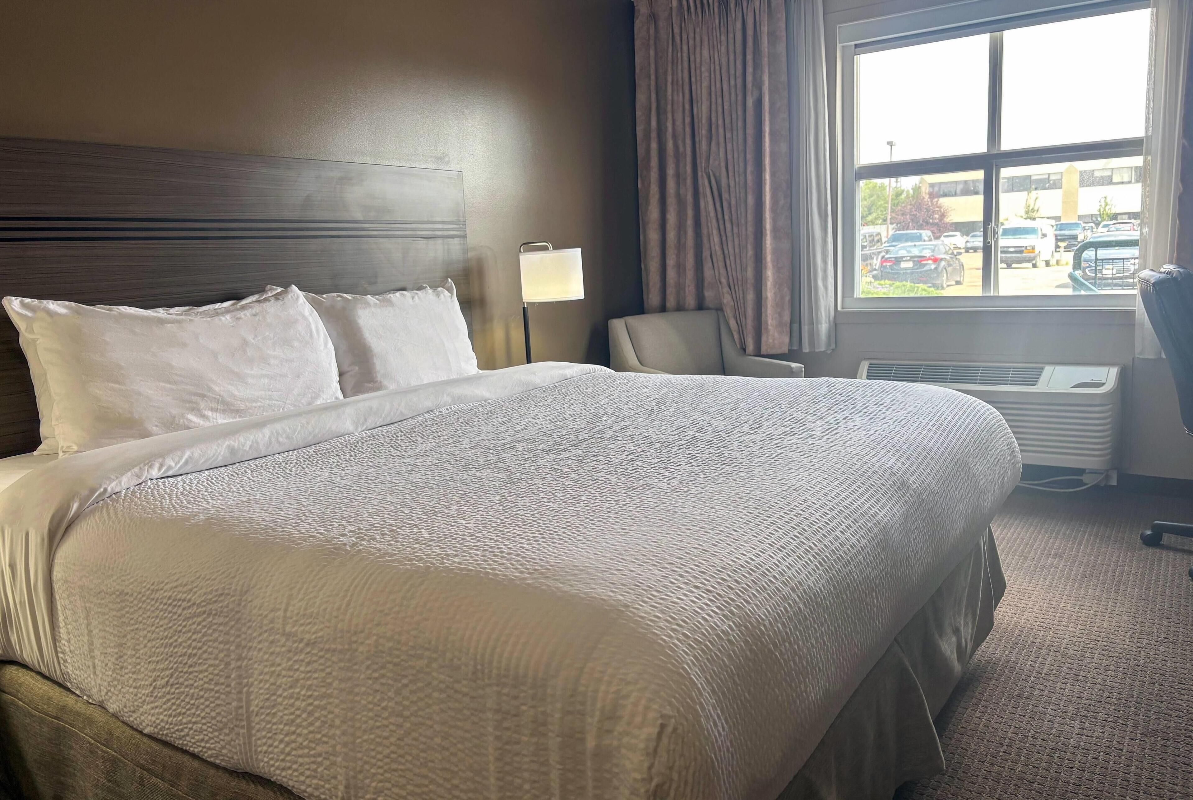 Room, 1 King Bed, Non Smoking | In-room safe, desk, laptop workspace, blackout curtains