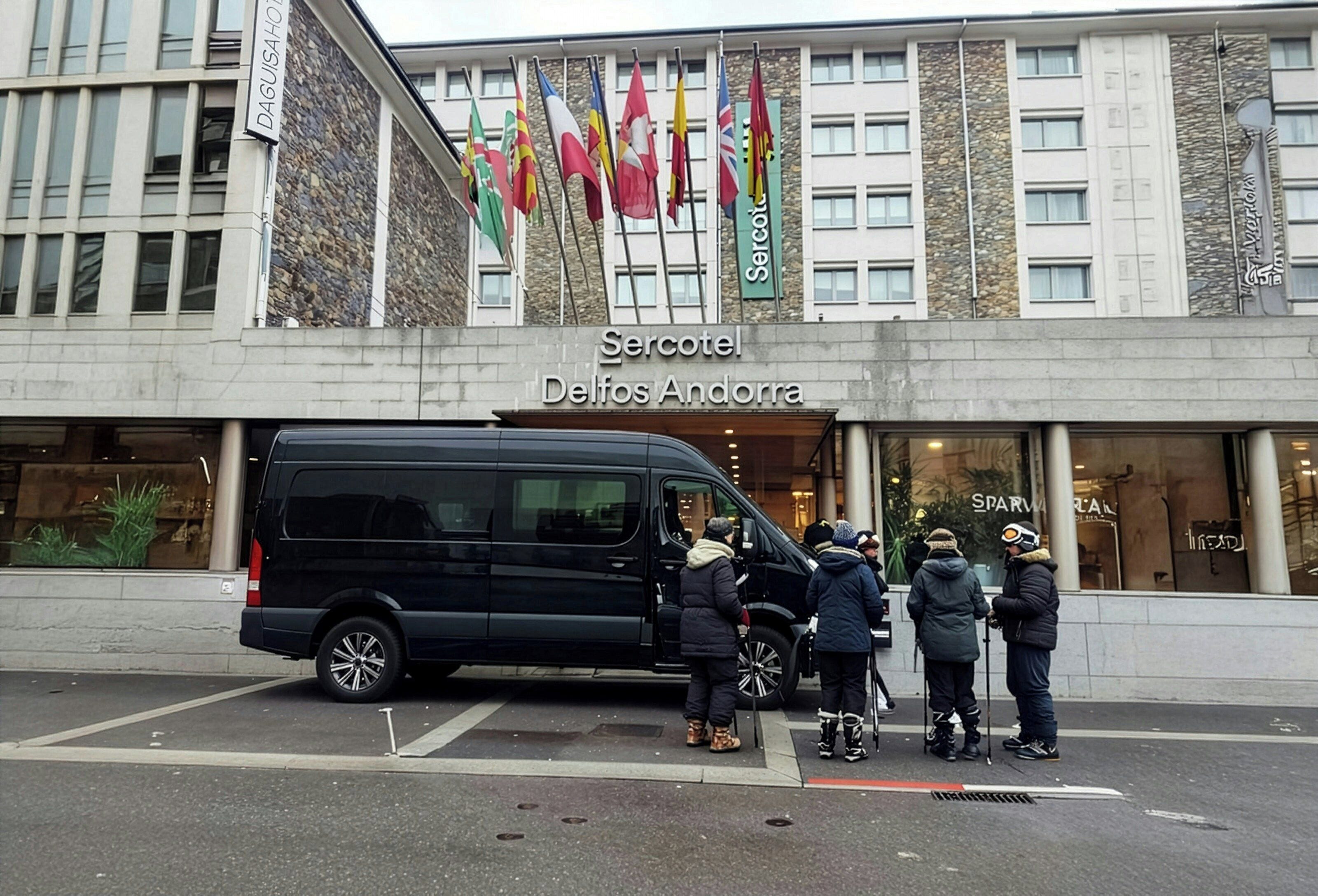 Un edificio con un letrero que dice 'Serotel Delfos Andorra' y varias banderas.