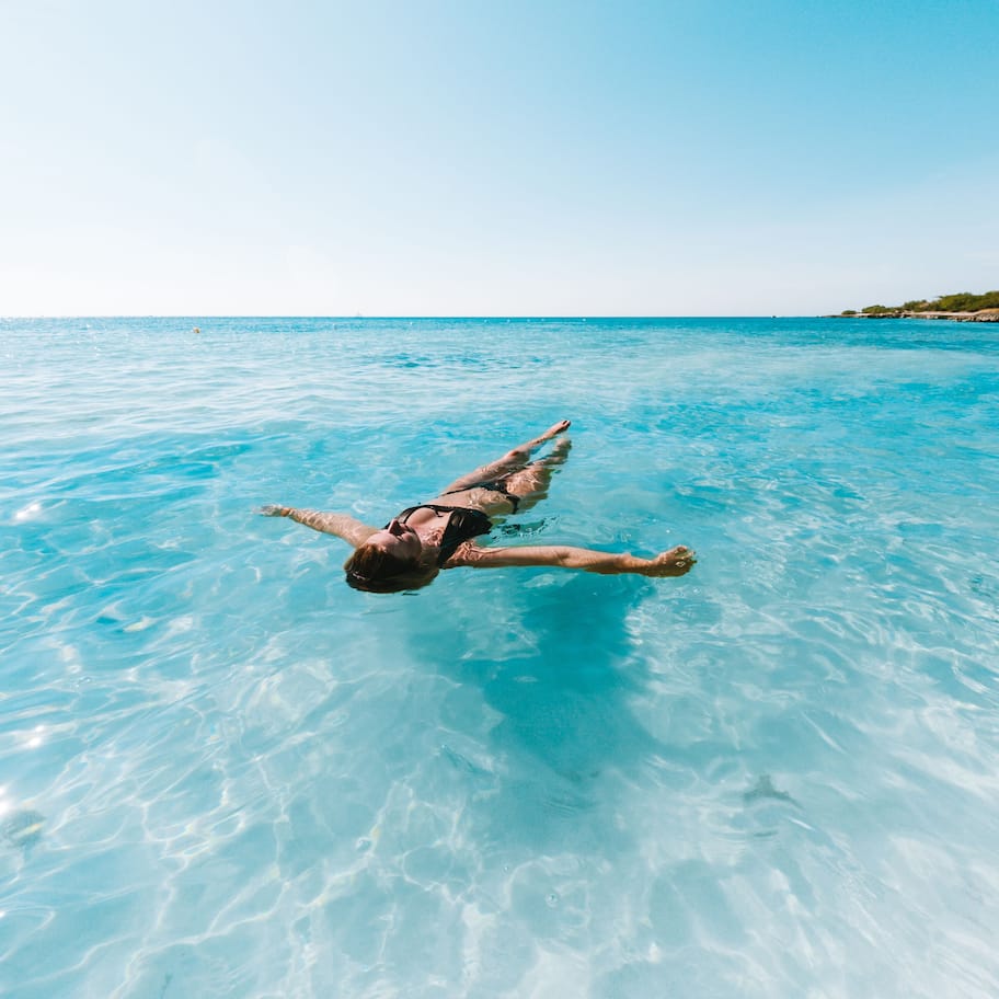 On the beach, white sand, sun loungers, beach umbrellas
