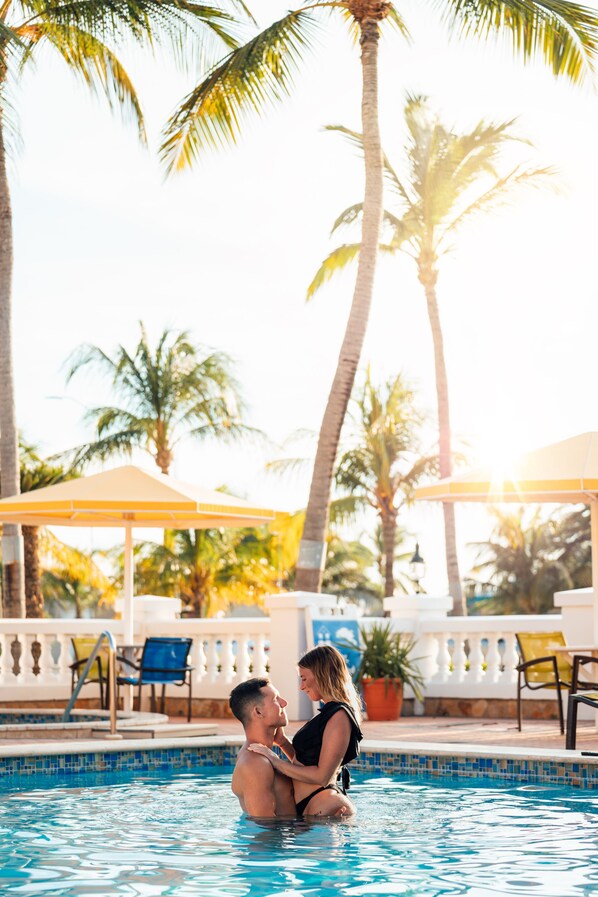 Outdoor pool, open 8:00 AM to 8:00 PM, pool umbrellas, sun loungers