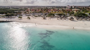 On the beach, white sand, free beach cabanas, sun loungers