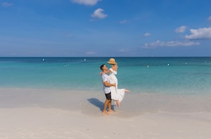 On the beach, white sand, free beach cabanas, sun loungers