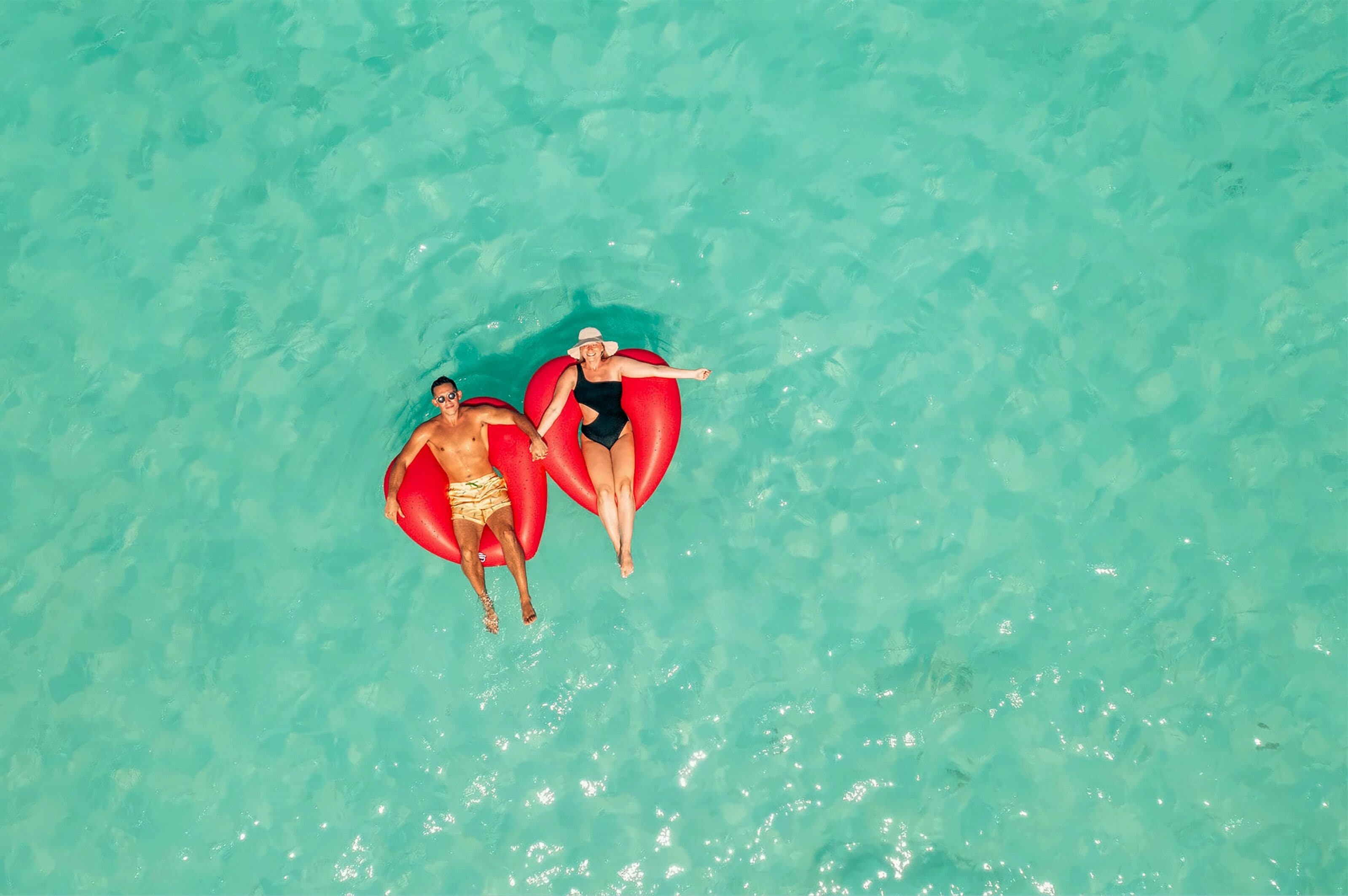 On the beach, white sand, sun-loungers, beach umbrellas