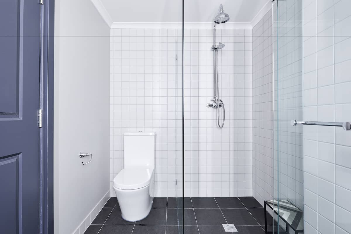 brassey family suite | bathroom | shower, free toiletries, hair dryer, slippers