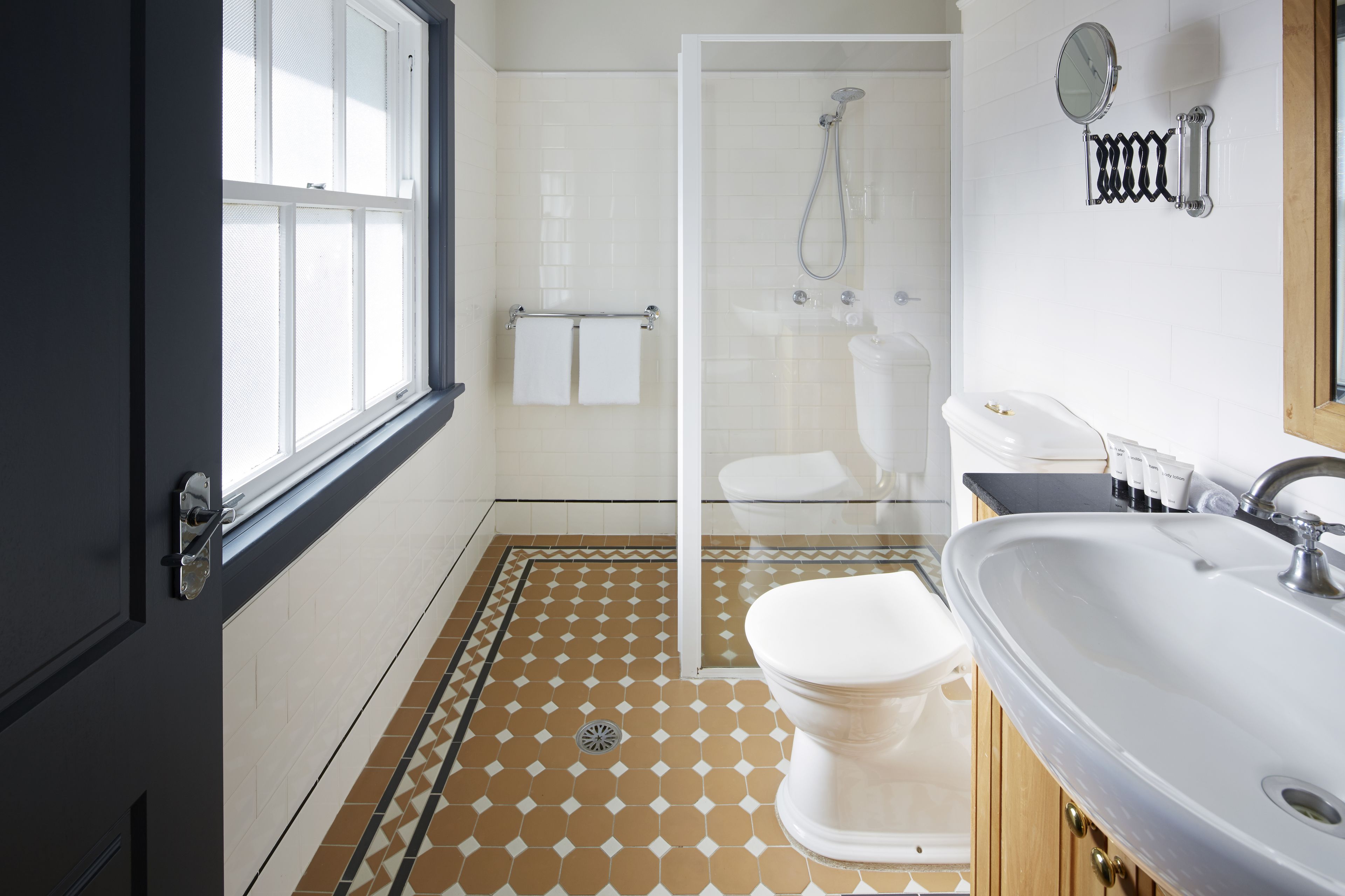 belmore one bedroom suite | bathroom | shower, free toiletries, hair dryer, slippers