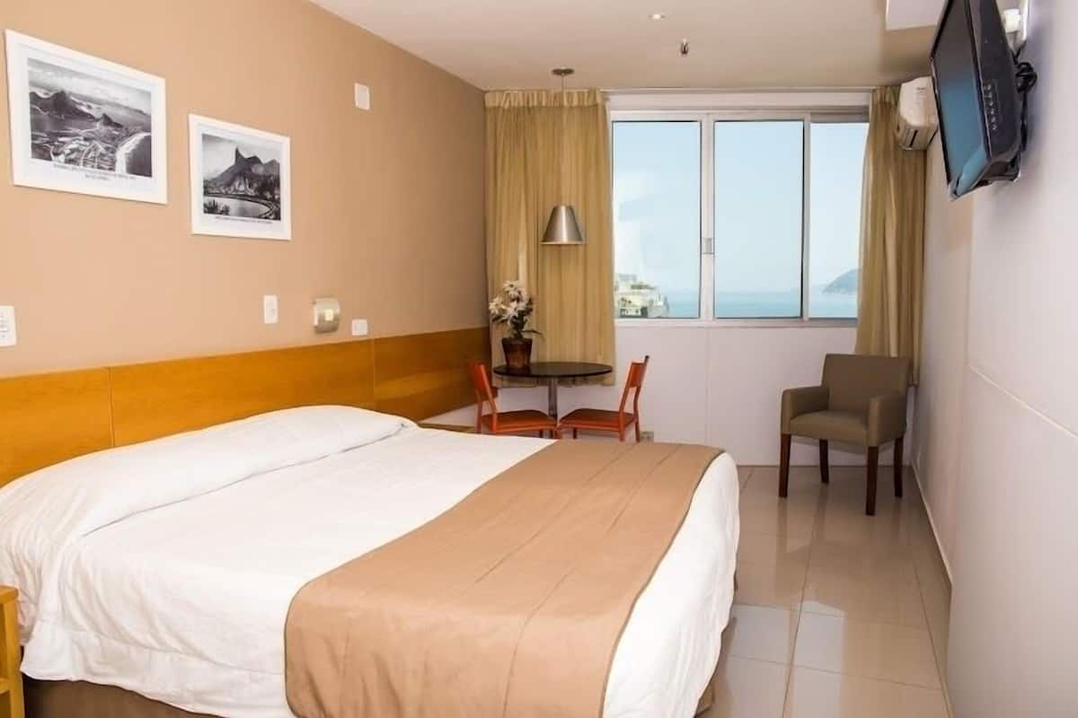 Deluxe Double Room | Minibar, in-room safe, blackout drapes, free WiFi