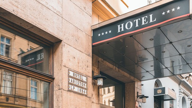 A hotel entrance with a sign reading "HOTEL PARISTON LP 1894". - Hotel Ariston & Ariston Patio (Prague)