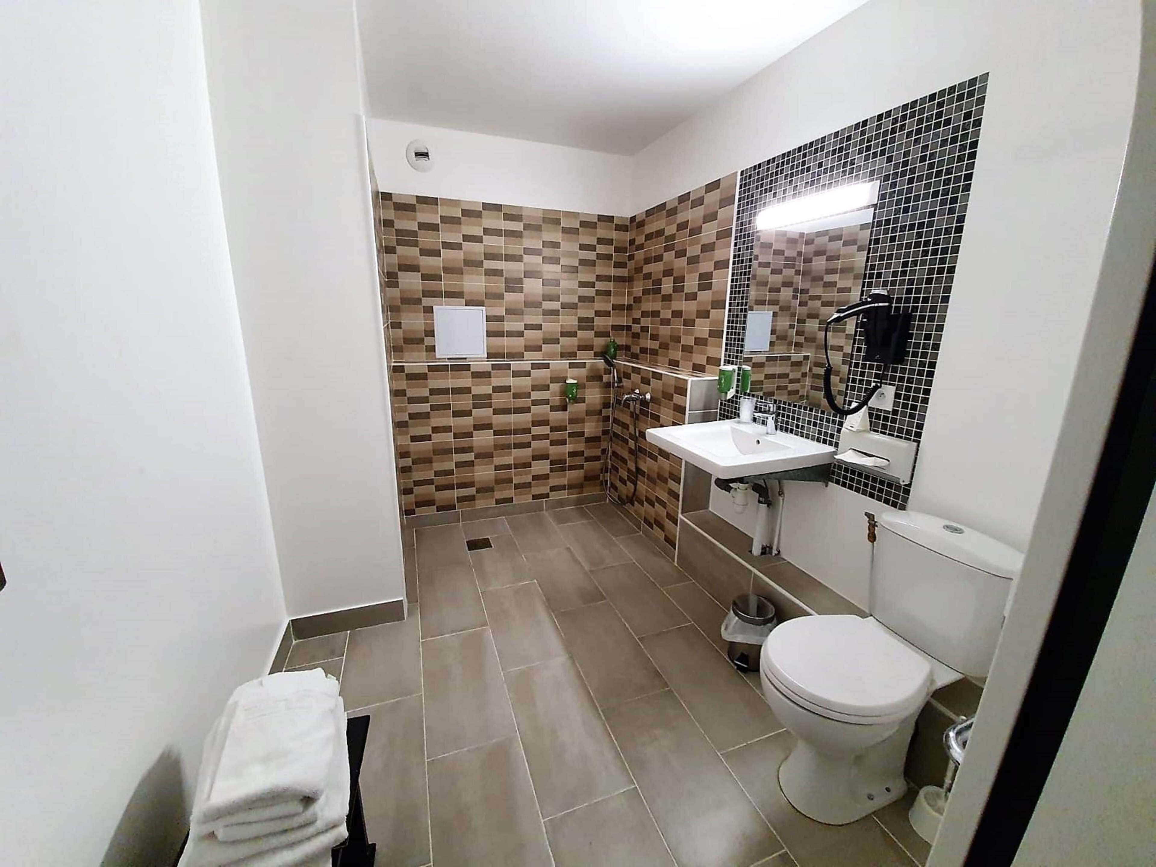 eco-friendly toiletries, hair dryer, towels