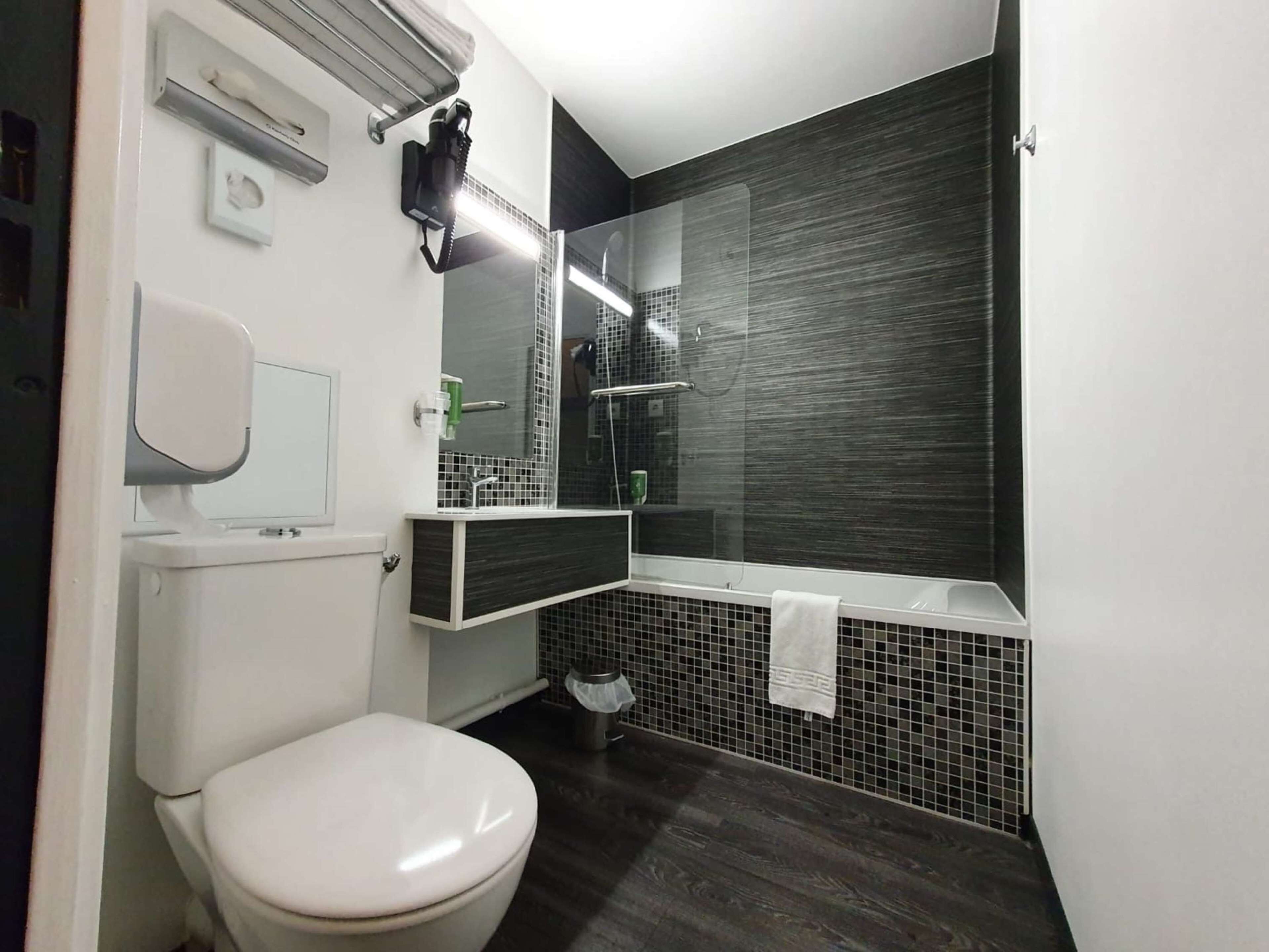 eco-friendly toiletries, hair dryer, towels