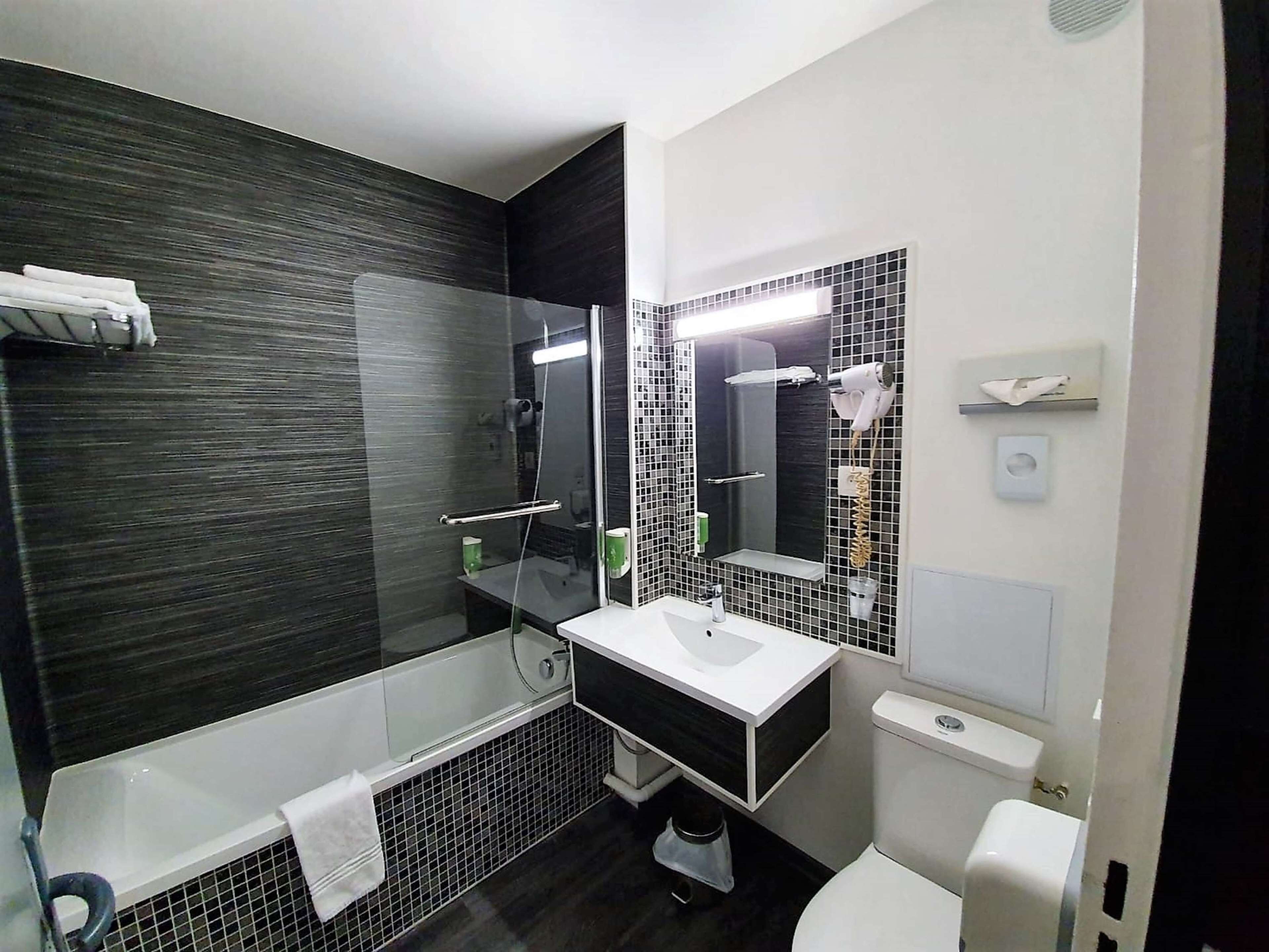 eco-friendly toiletries, hair dryer, towels