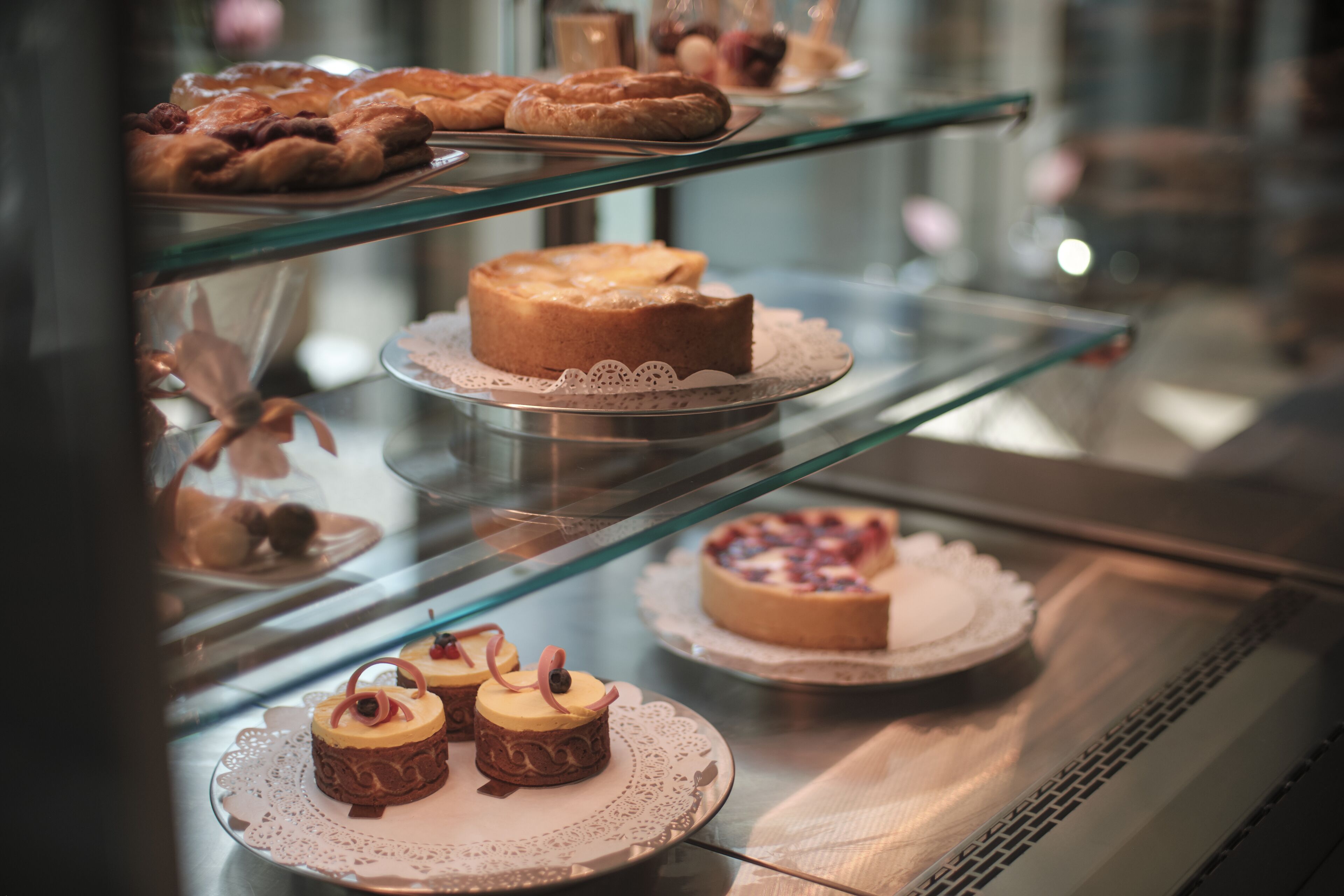 A bakery display case with various baked goods.
