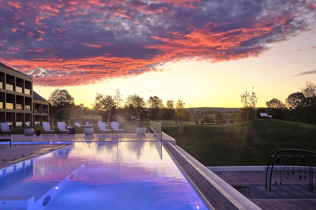 indoor pool, outdoor pool, pool umbrellas, pool loungers