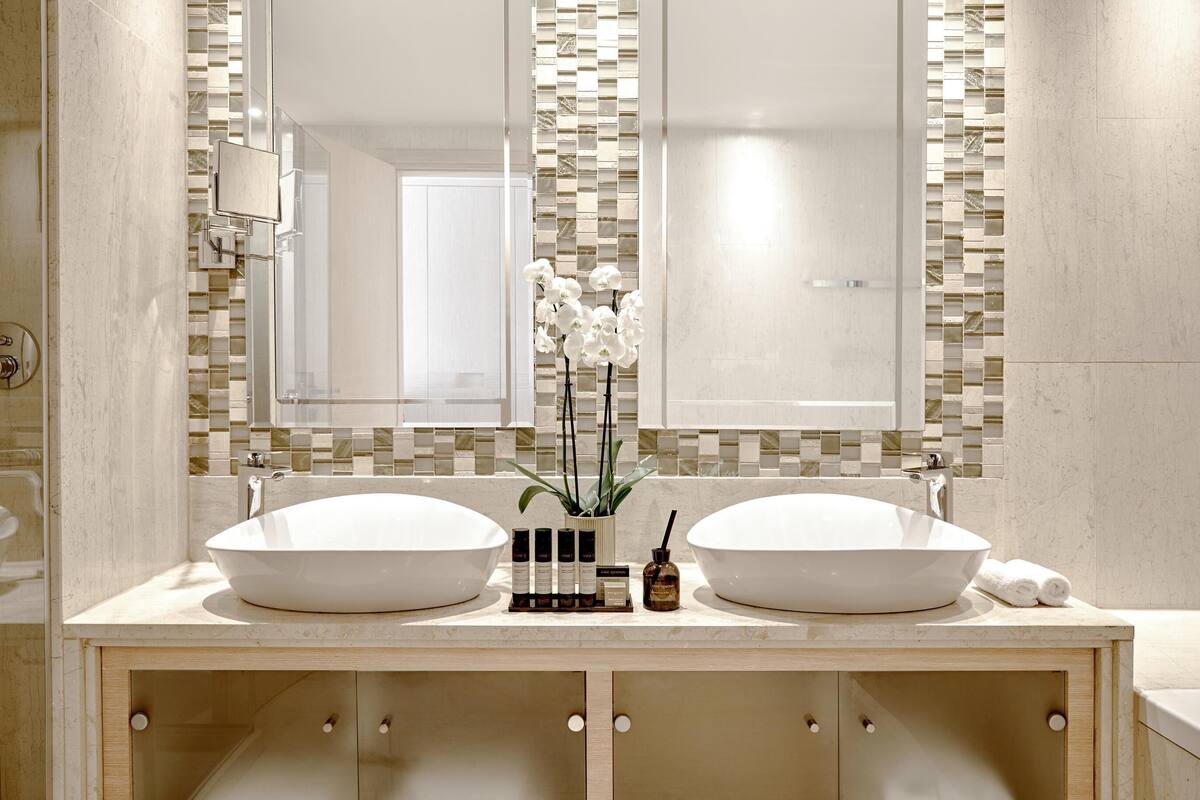 separate bathtub and shower, designer toiletries, hair dryer, bathrobes