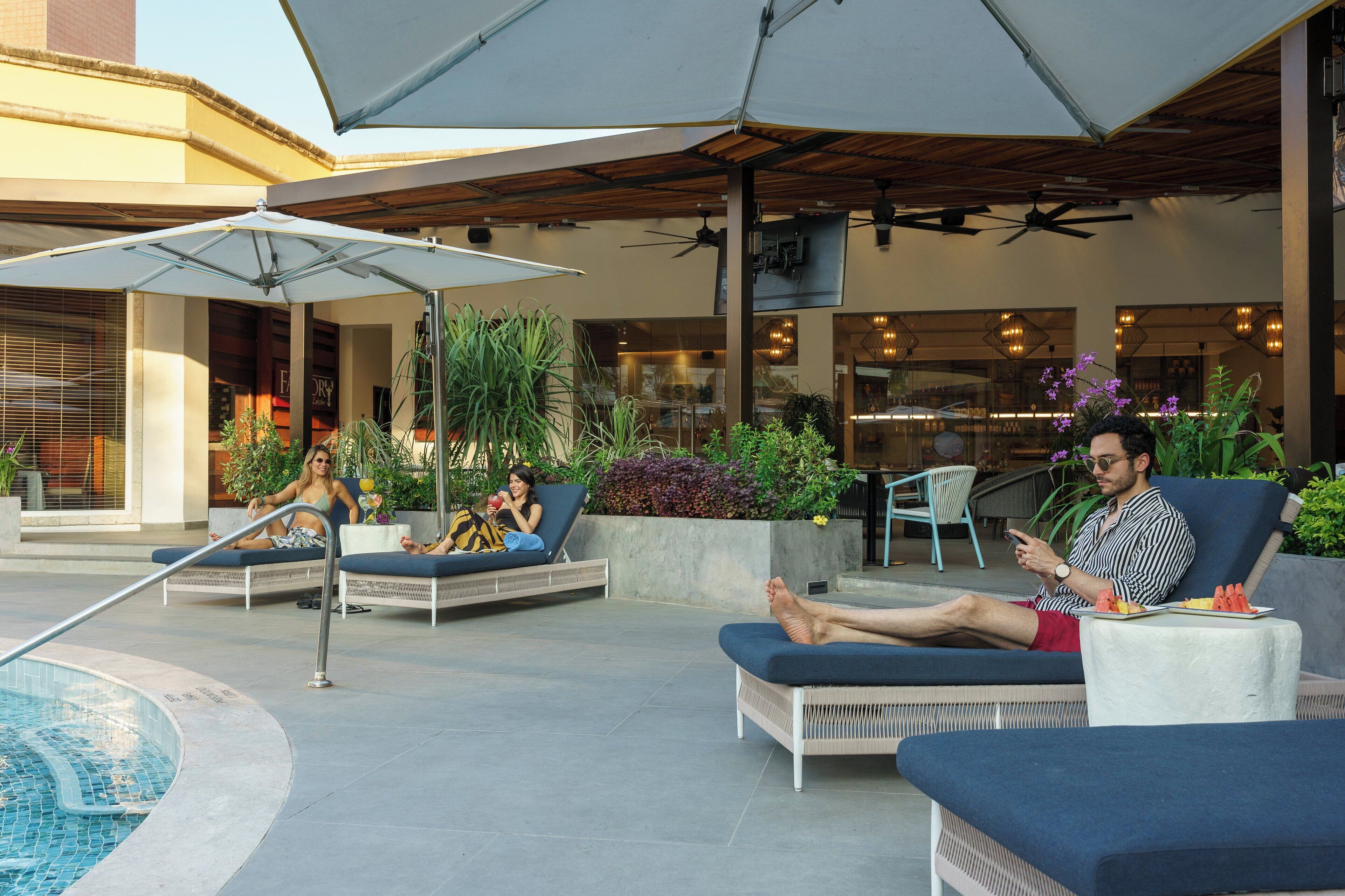 Outdoor pool, pool umbrellas, sun loungers