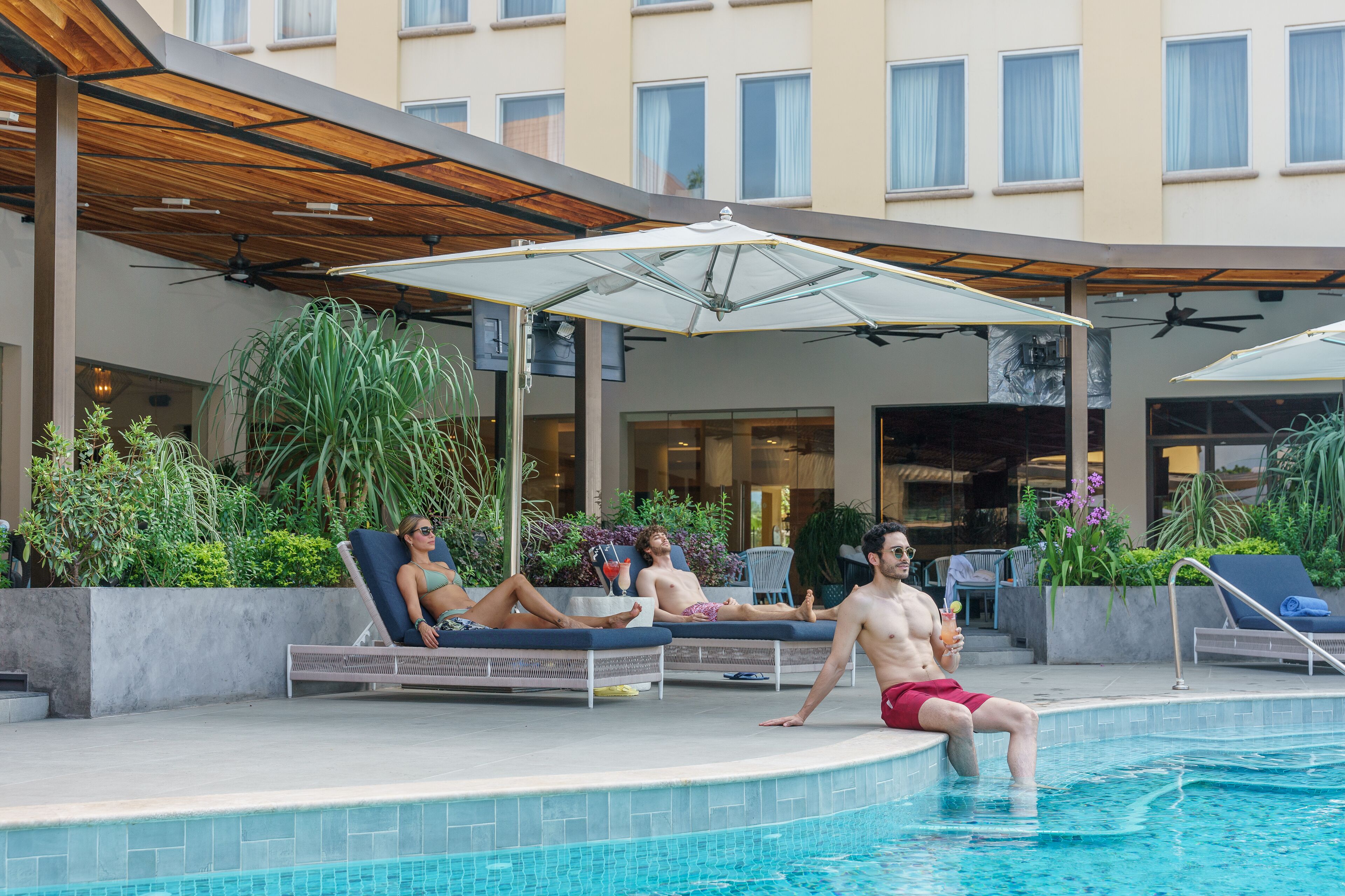 outdoor pool, pool umbrellas, pool loungers