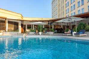 Outdoor pool, pool umbrellas, sun loungers