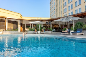 Outdoor pool, pool umbrellas, sun loungers