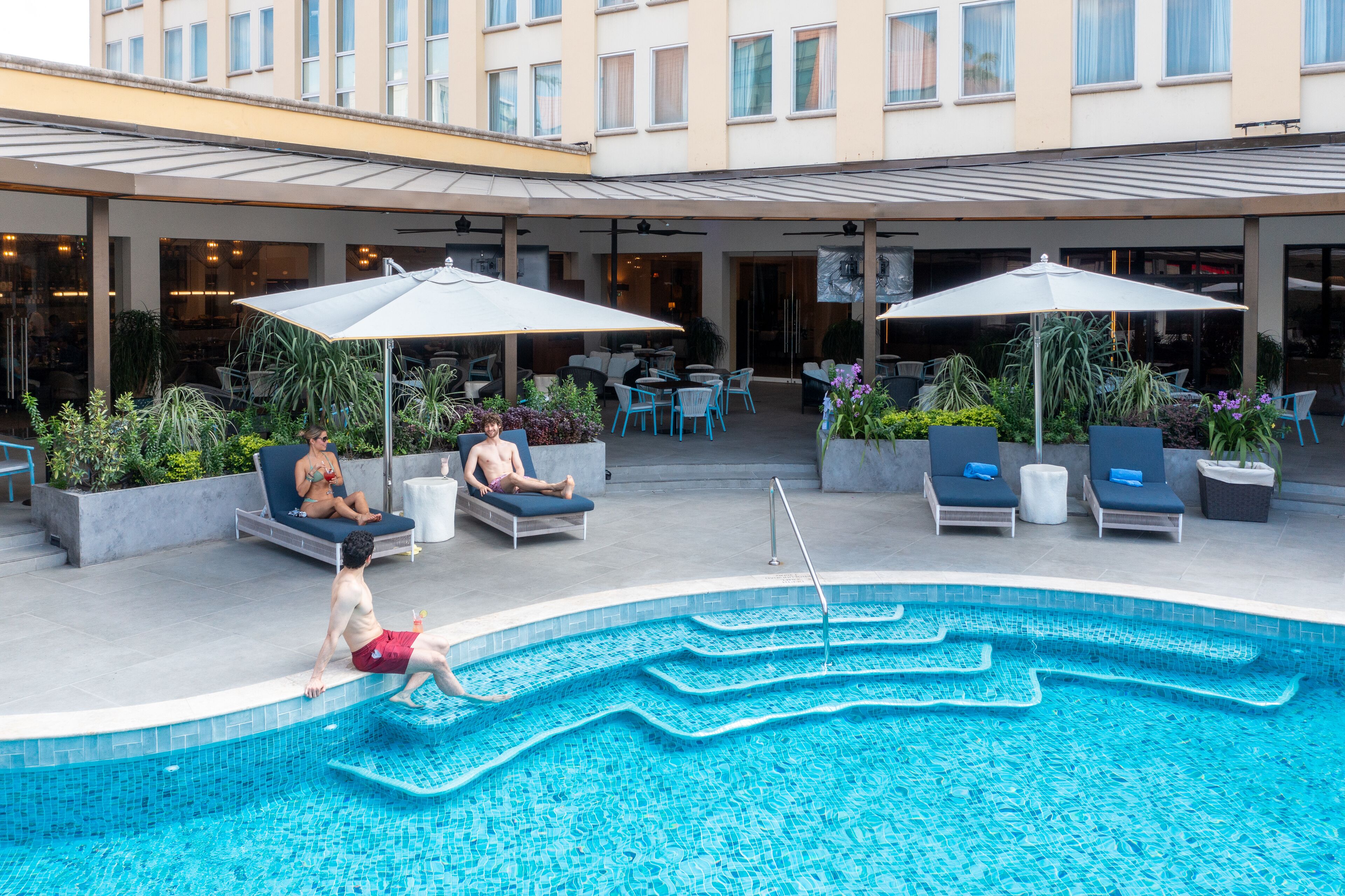 outdoor pool, pool umbrellas, pool loungers