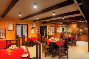 Breakfast, lunch, dinner served; international cuisine, garden views 