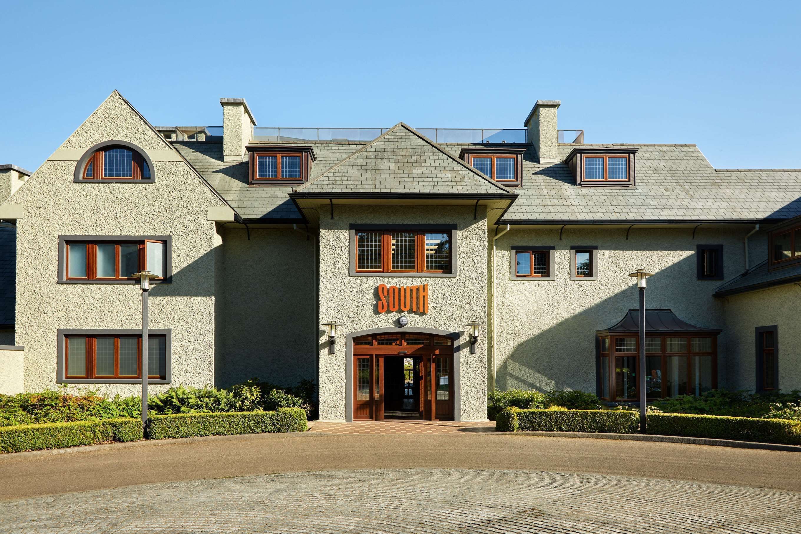 A large, two-story building with a prominent 'SOUTH' sign above the entrance.