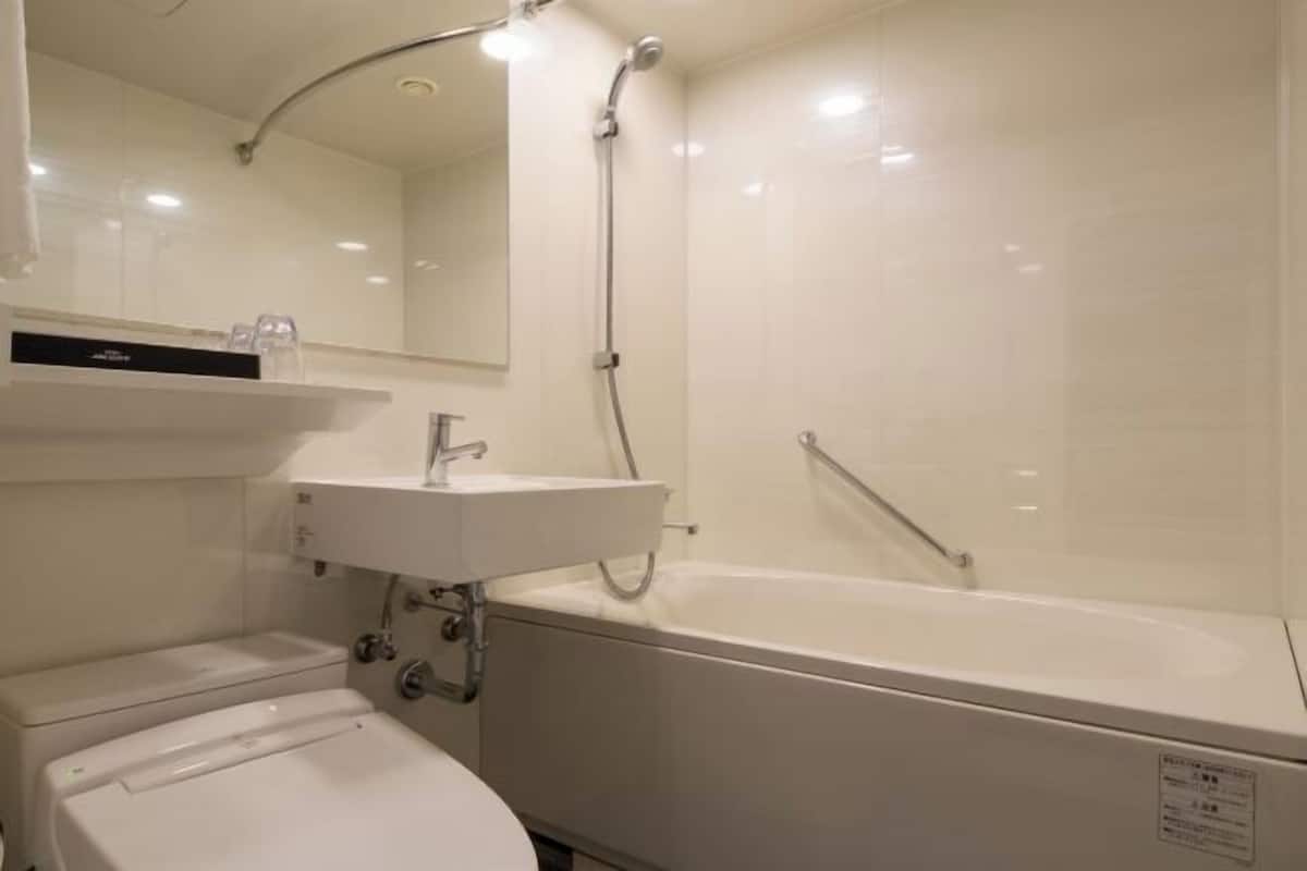 Bathroom | Shower, free toiletries, hair dryer, slippers