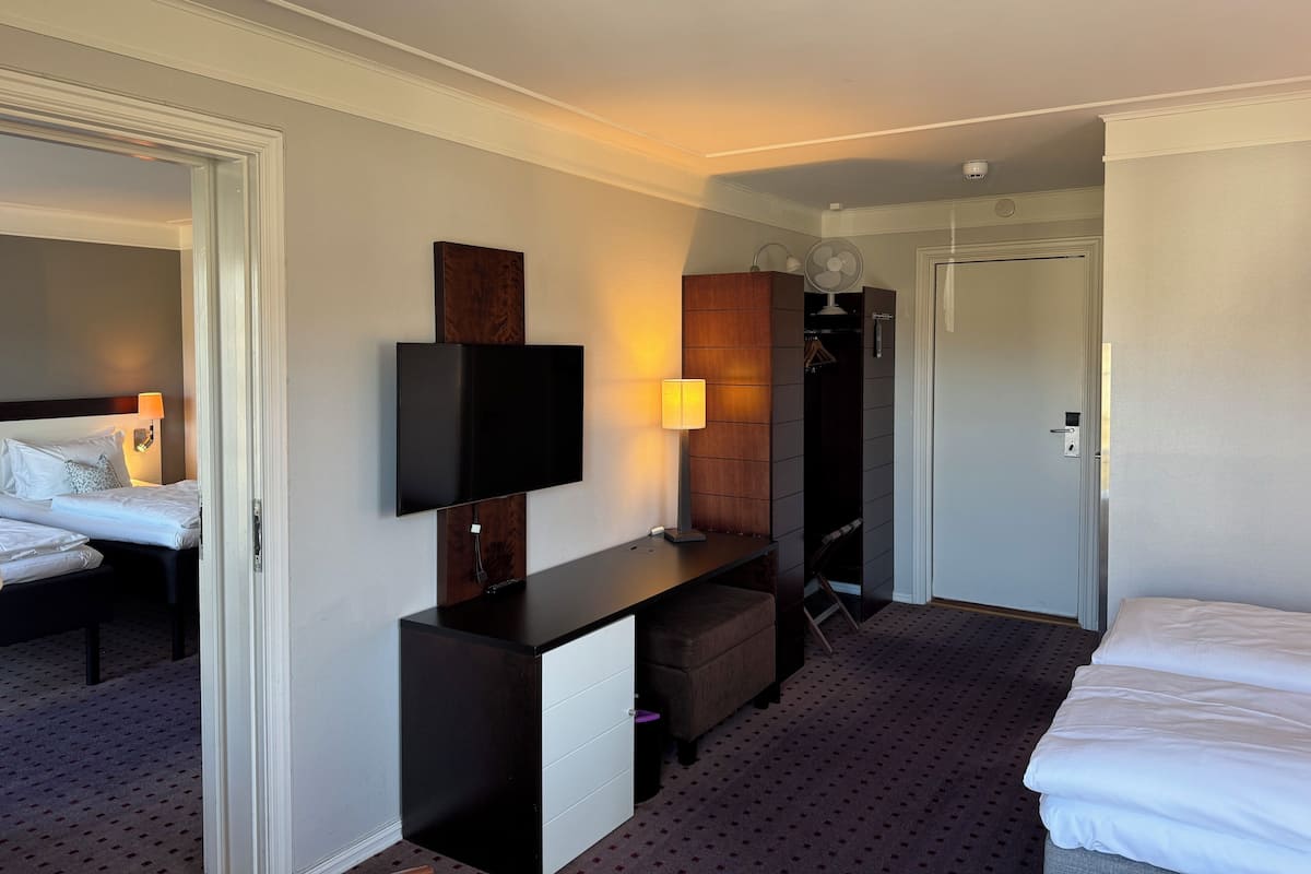 Family Room, Connecting Rooms | 2 bedrooms, pillowtop beds, blackout drapes, bed sheets