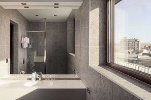 Designer toiletries, hair dryer, towels