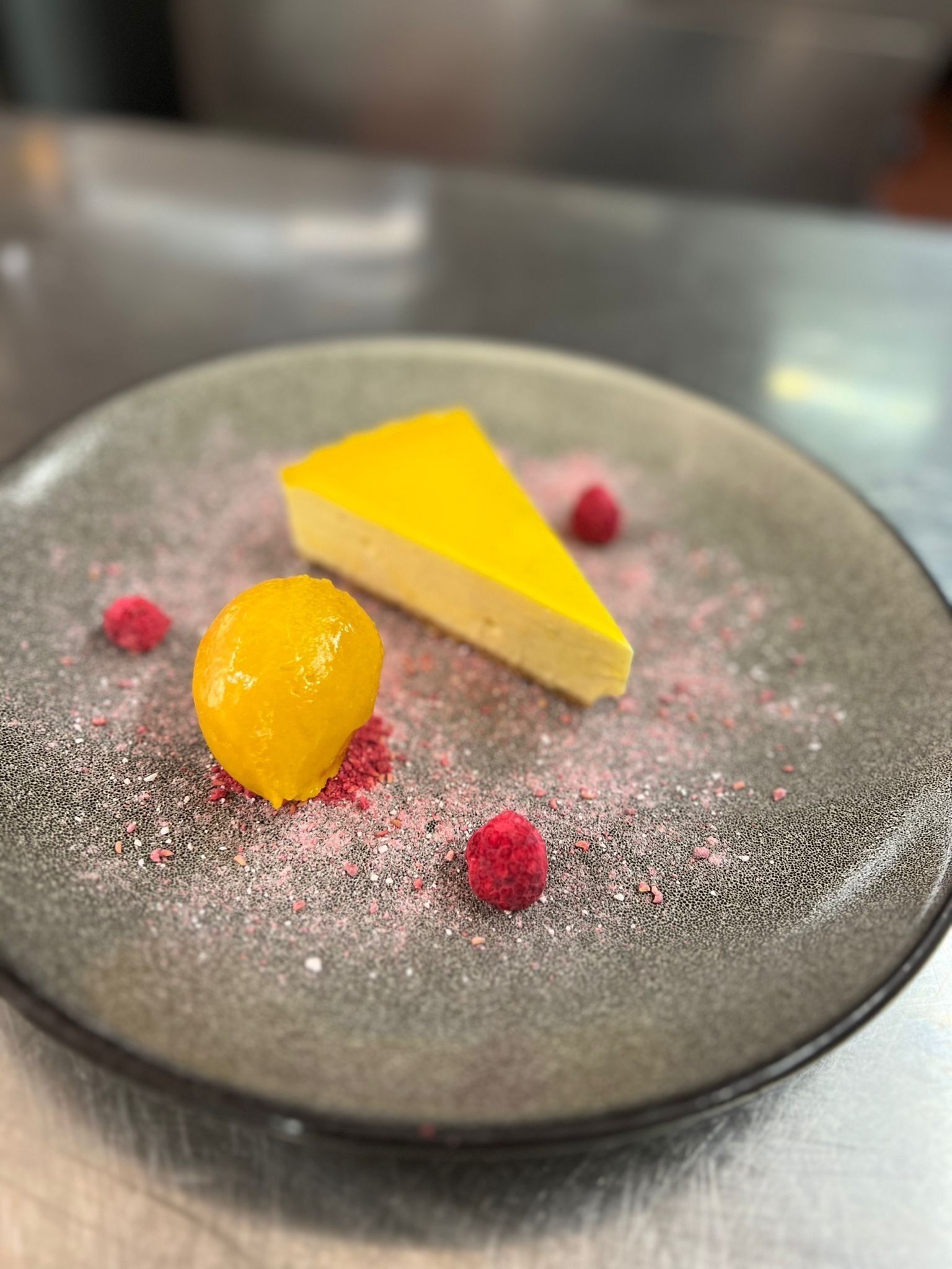 A dessert on a plate with a textured surface.