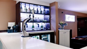 A hotel reception area with a bar, a computer, and a desk with a keyboard and mouse. - Holiday Inn Express Glenrothes by IHG (Glenrothes)