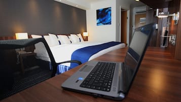 Desk, laptop workspace, iron/ironing board, free cribs/infant beds