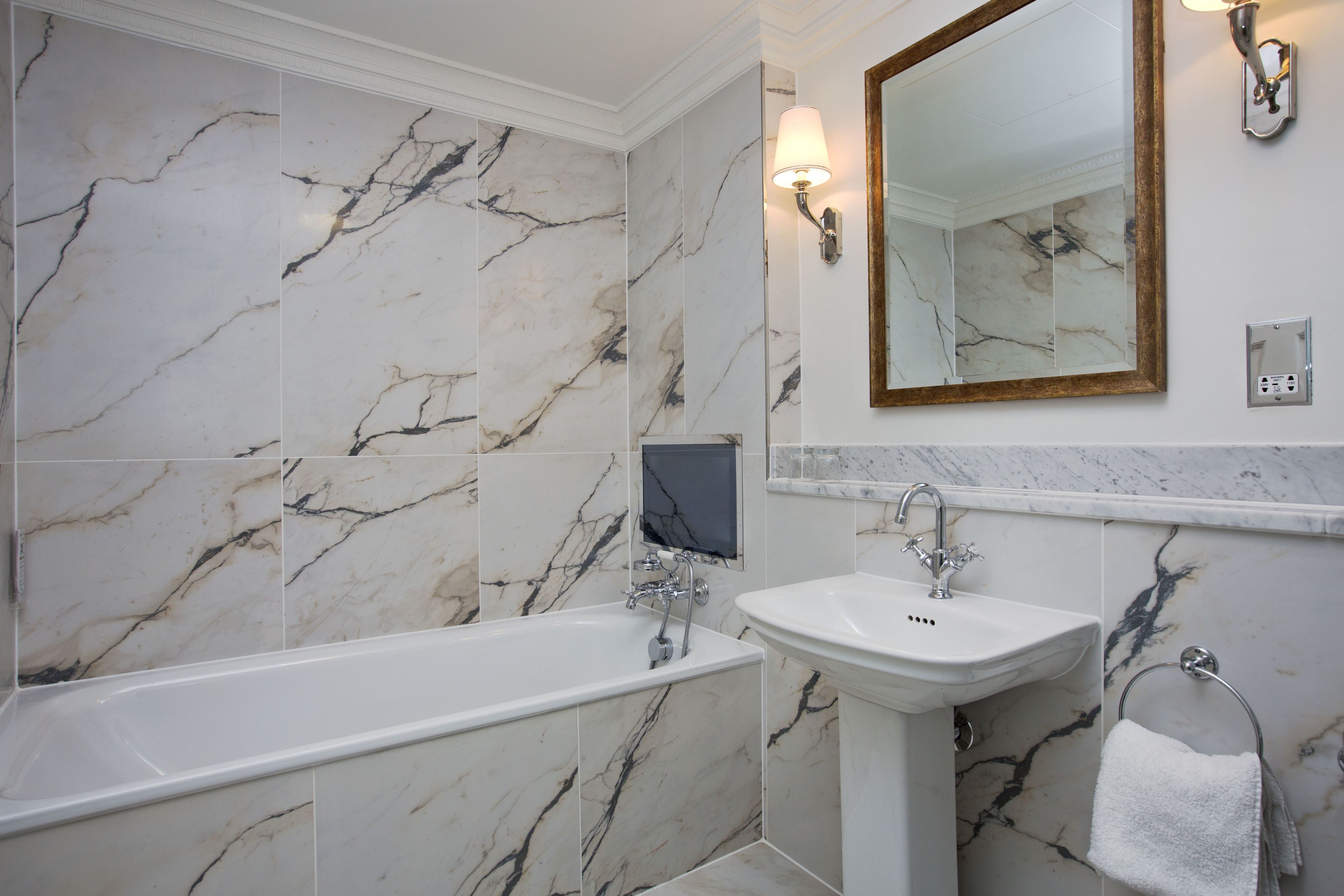 deluxe king bedded room in historic mansion house | bathroom | designer toiletries, hair dryer, bathrobes, slippers