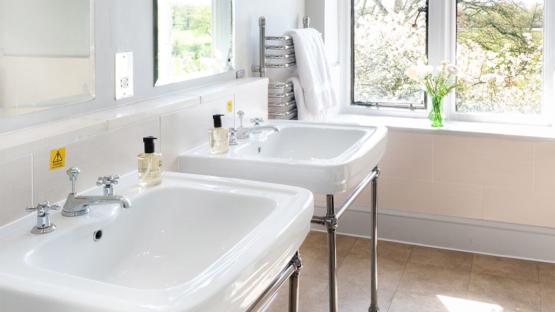 combined shower/bathtub, designer toiletries, hair dryer, bathrobes