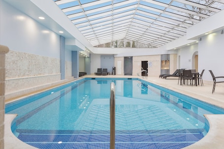 Indoor pool, open 7:00 AM to 9:00 PM, sun loungers