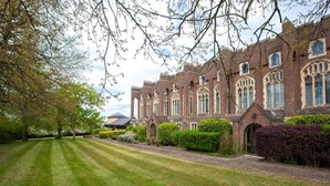 A large brick building with arched windows and a well-manicured lawn. - London Chigwell Prince Regent Hotel, BW Signature Collection (Woodford Green)