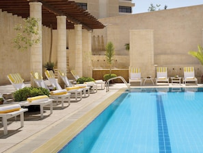 Outdoor pool, open 6:00 AM to 10:00 PM, pool umbrellas, sun loungers