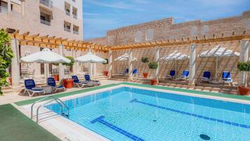 Outdoor pool, open 6:00 AM to 10:00 PM, pool umbrellas, sun loungers