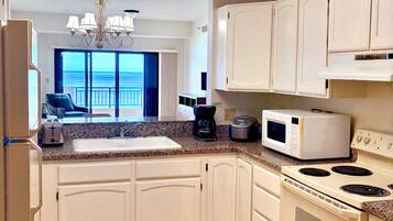 Fridge, microwave, stovetop, coffee/tea maker