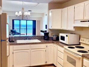 Fridge, microwave, stovetop, coffee/tea maker