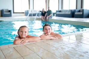 Indoor pool, open 7:00 AM to 10:00 PM, pool loungers
