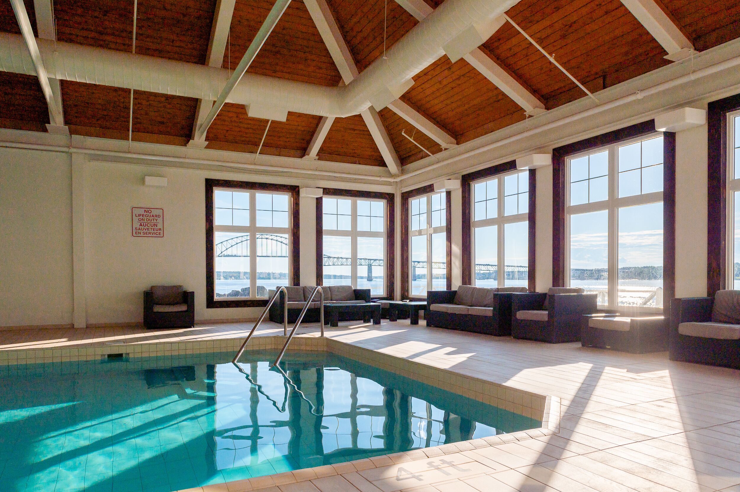 indoor pool, open 7:00 am to 10:00 pm, pool loungers