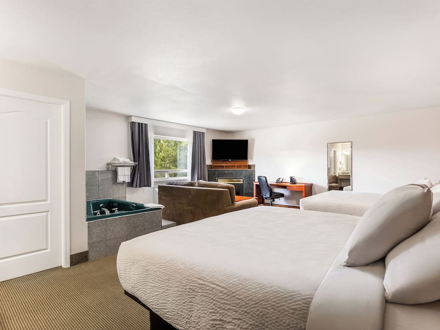 Deluxe Room, Multiple Beds, Non Smoking | In-room safe, desk, iron/ironing board, free WiFi
